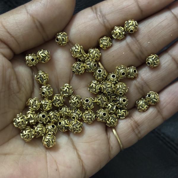 Antique Gold Swasthik Nakshi balls 4mm Sold By 1 pc