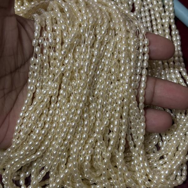 Light weight Cream shade Rice Pearls 4mm Sold By Bunch (10-12 lines)